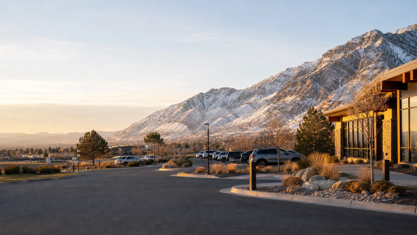 An orderly Utah Valley property arrival beneath the snow-dusted Wasatch Range at sunrise